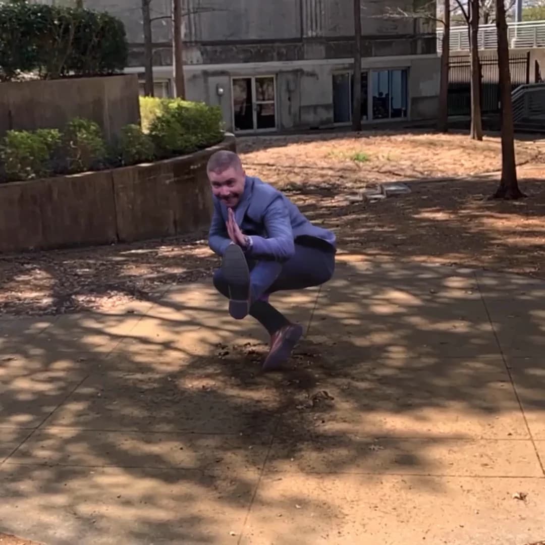 AR Capture 05: a captured guest frozen in a crouching pose in an outdoor courtyard